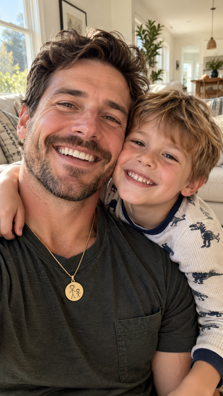 Father and son together, father wearing a keepsake drawing necklace